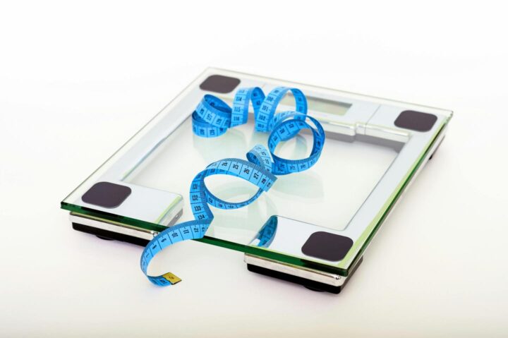 A scale and a measuring tape for weight control