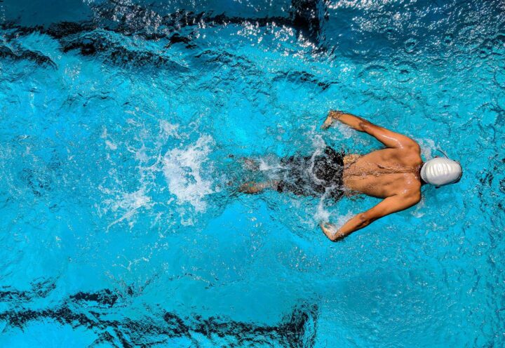 A man swimming in a pool